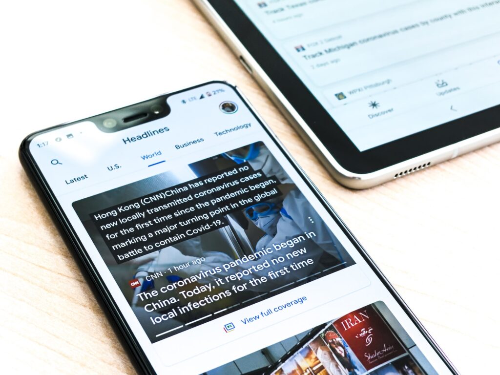 silver iphone 6 on brown wooden table